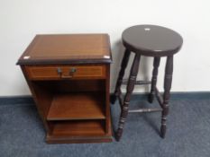 A set of narrow open shelves fitted a drawer in a mahogany finish together with a bar stool