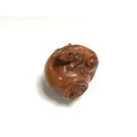 A carved Chinese hardwood netsuke - Two rats on a pot