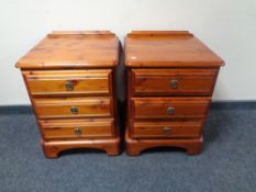 A pair of Ducal pine three drawer bedside chests