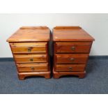 A pair of Ducal pine three drawer bedside chests