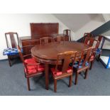 A twelve piece Chinese dining room suite comprising of four door low sideboard fitted drawers above,