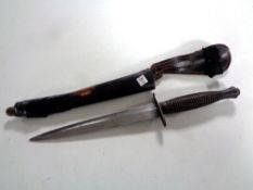 A Fairbairn Sykes third pattern fighting knife in sheath