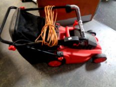 A Estore electric lawn mower with grass box and lead