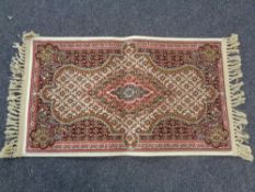 A Persian silk finished fringed prayer rug