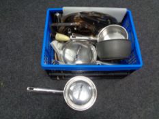 A box containing assorted aluminium pans, Pyrex dish, cooking utensils,