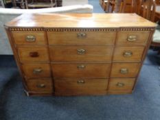 A George III inlaid mahogany break front four drawer chest (as found)