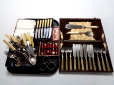 A tray containing cased and loose silver plated and stainless steel cutlery together with two