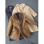 A box containing three lady's coats to include sheepskin,