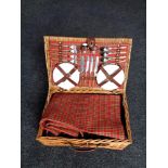 A wicker cased picnic set together with a treen and plated lidded biscuit barrel