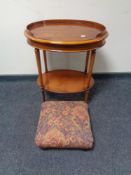 An oval yew wood two tier occasional table together with a tapestry upholstered foot stool on bun