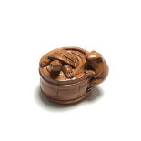 A carved Chinese hardwood netsuke - Turtle and frog by a barrel