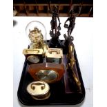 A tray containing assorted mantel clocks, brass figure, mare with foal,