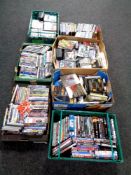 Seven boxes containing a large quantity of DVDs,