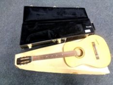 A Conn trumpet case together with a Musima acoustic guitar in box