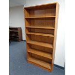 A set of 20th century teak veneered open bookshelves