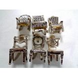 Six silver plated miniature chairs