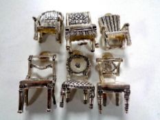 Six silver plated miniature chairs