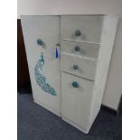 A 20th century painted gentleman's wardrobe fitted cupboard and three drawers
