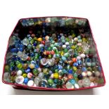 A tin containing glass marbles