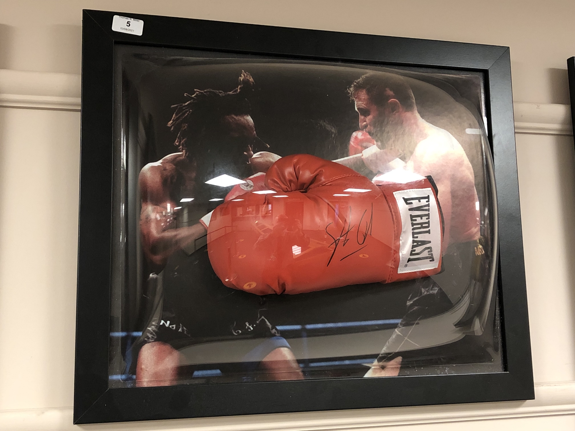 A sporting memorabilia montage : A signed red Everlast boxing glove, Steve Collins,