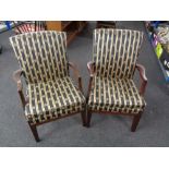 A pair of Parker Knoll armchairs upholstered in a striped fabric