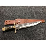 A large hunting knife in leather sheath