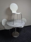 A circular marble topped metal based bistro style table together with a set of three contemporary