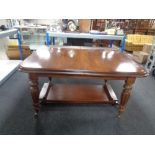 A Victorian style mahogany wind out dining table with two leaves