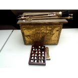 A brass embossed coal box together with assorted companion pieces,