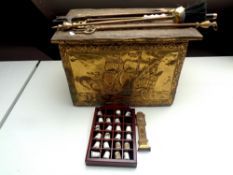 A brass embossed coal box together with assorted companion pieces,