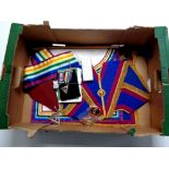 A box containing a quantity of Masonic regalia to include bag, sashes,