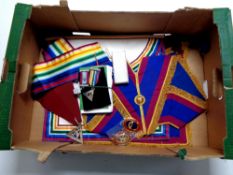 A box containing a quantity of Masonic regalia to include bag, sashes,