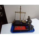 A set of antique brass chemist's scales together with small quantity of weights and a further set