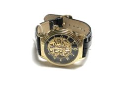 A Gentleman's Stuhrling skeleton style wrist watch