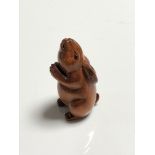 A carved Chinese hardwood netsuke - Rabbit