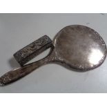 A silver backed hand mirror together with a silver embossed box