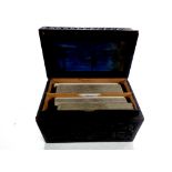 A carved ebonised card box