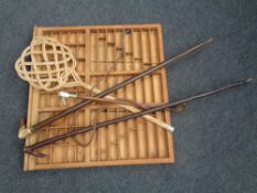 A printer's type tray together with two walking sticks,