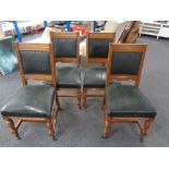 A set of four Edwardian oak armchairs