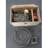 A pressure washer with accessories and workshop light in a fitted box