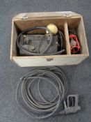 A pressure washer with accessories and workshop light in a fitted box