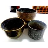 Three antique brass plant pots