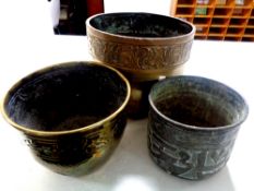 Three antique brass plant pots