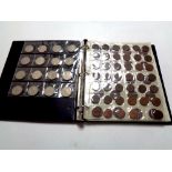 A coin collector's album containing pre decimal British coinage to include George V and Queen