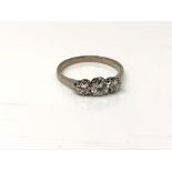 A good antique platinum three stone diamond ring, the central stone approximately 0.5ct. Size M.