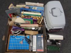 Two boxes containing vintage typewriter, books, door stops, fax rolls, electrical kit,