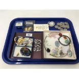 A tray of silver and costume jewellery, coins,