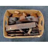 A box containing a large quantity of vintage woodwork planes