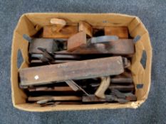 A box containing a large quantity of vintage woodwork planes