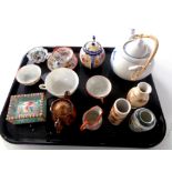 A tray containing oriental wares to include teapots, teacups and tea bowls,